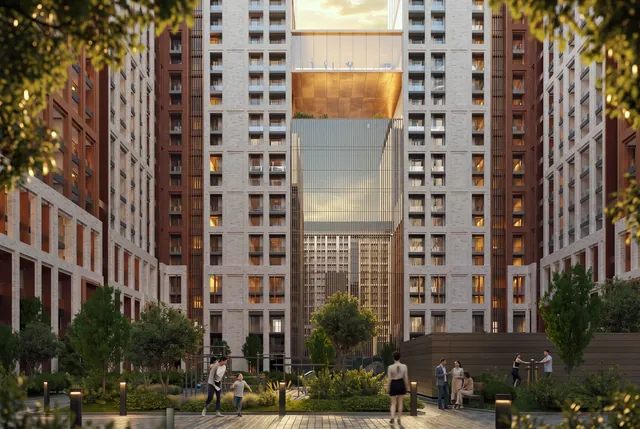 Двор HAVEN: симметричные ворота между корпусами с мостом-переходом на закате